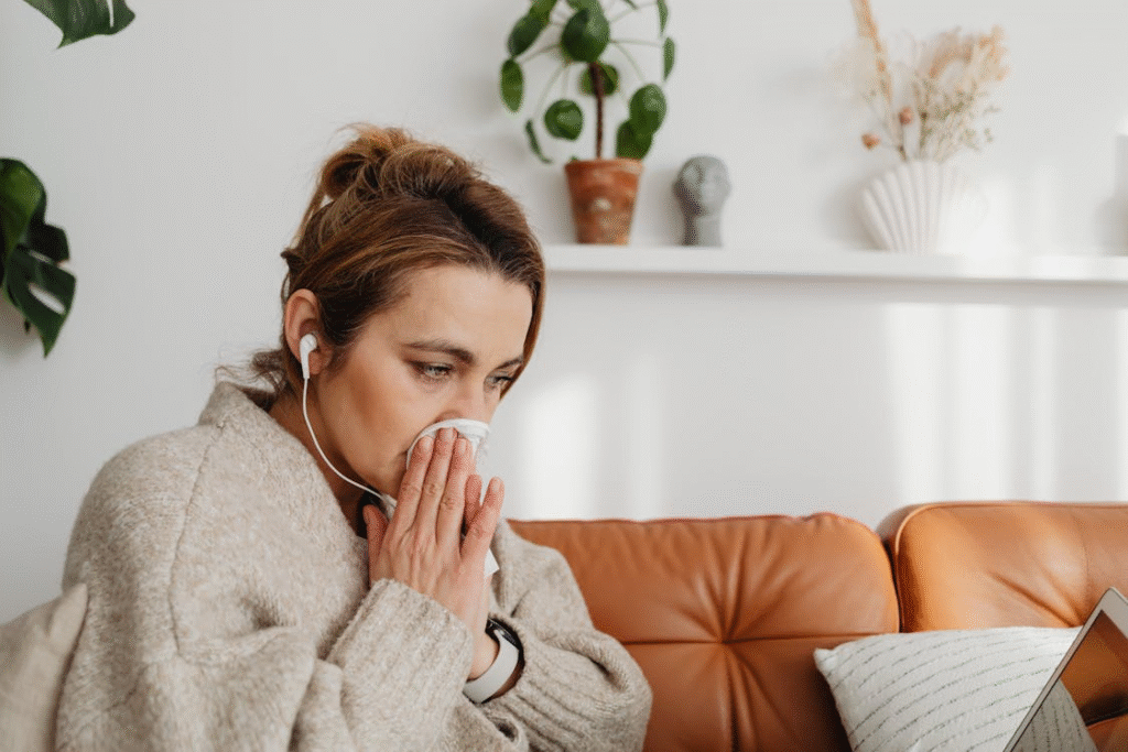 A young girl resting with flu symptoms, showing the need for preventive health care in Ohio.